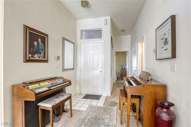 entryway with light tile patterned floors