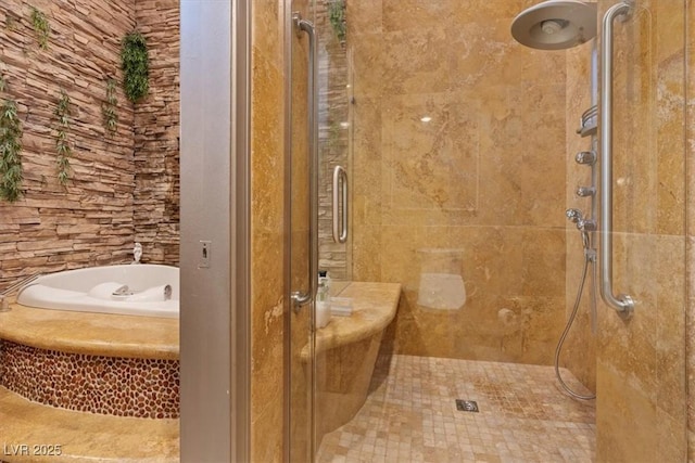 bathroom with separate shower and tub