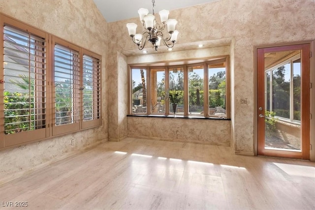 unfurnished dining area featuring a notable chandelier