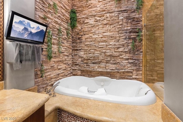 bathroom featuring a relaxing tiled tub