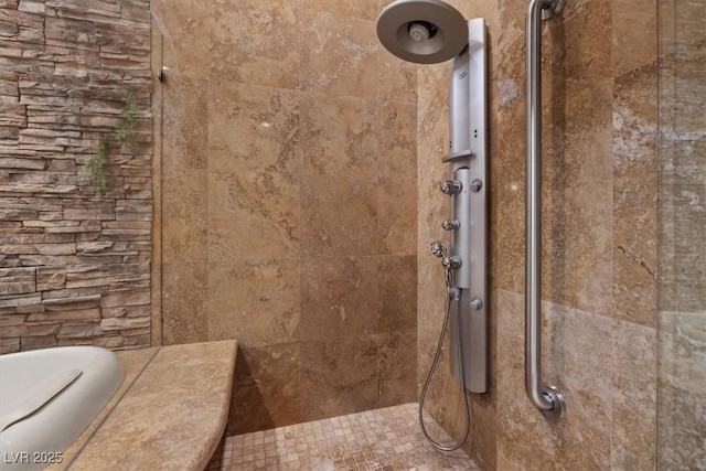 interior space with tiled shower