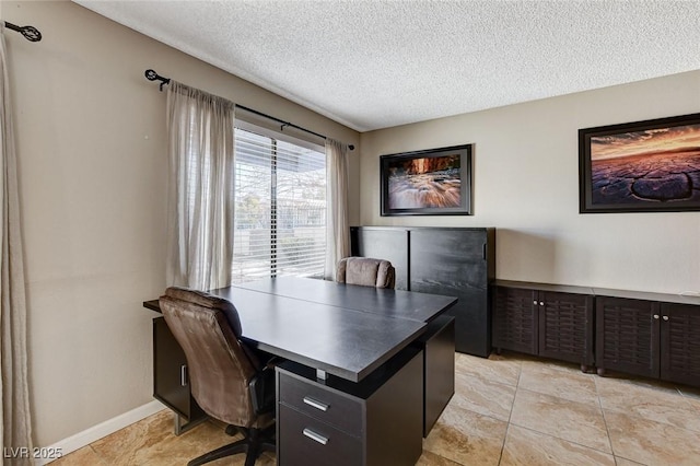 office space with a textured ceiling