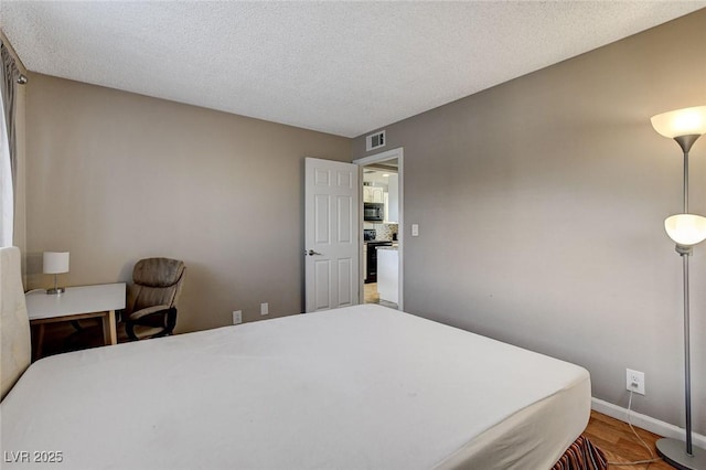 bedroom featuring a textured ceiling