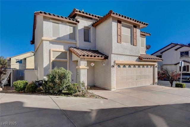 mediterranean / spanish-style home with a garage