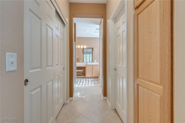 corridor with light tile patterned floors