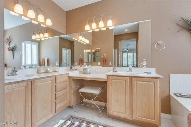 bathroom featuring tile patterned flooring, vanity, and ceiling fan