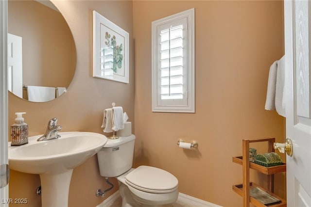 bathroom with sink and toilet