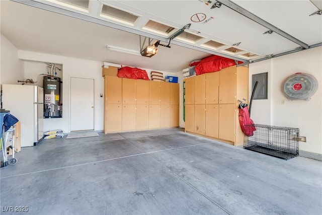 garage featuring white fridge, a garage door opener, electric panel, and water heater