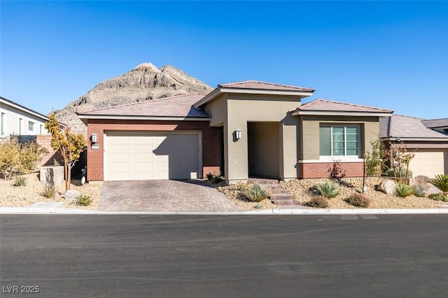 view of front of property featuring a mountain view and a garage