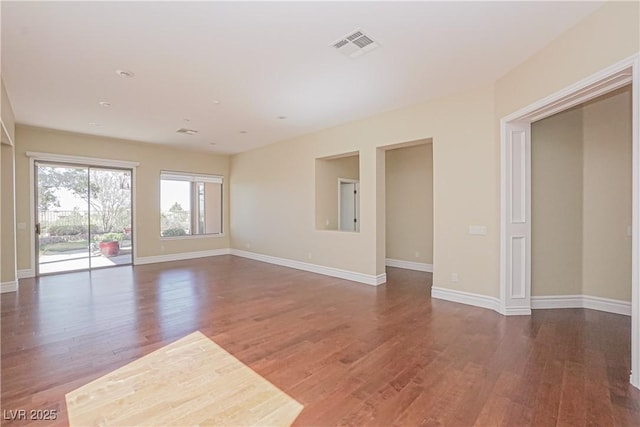 unfurnished room featuring dark hardwood / wood-style floors