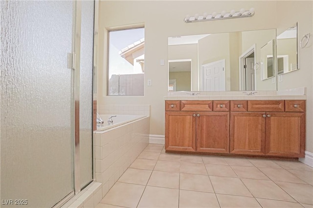 full bathroom with a sink, tile patterned flooring, double vanity, a shower stall, and a bath