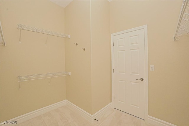 spacious closet with carpet floors