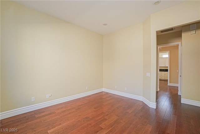 empty room with wood-type flooring