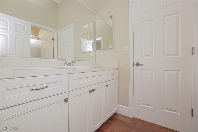 bathroom featuring vanity and hardwood / wood-style floors