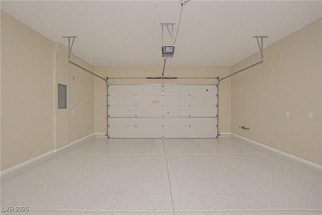 garage with baseboards, a garage door opener, and electric panel