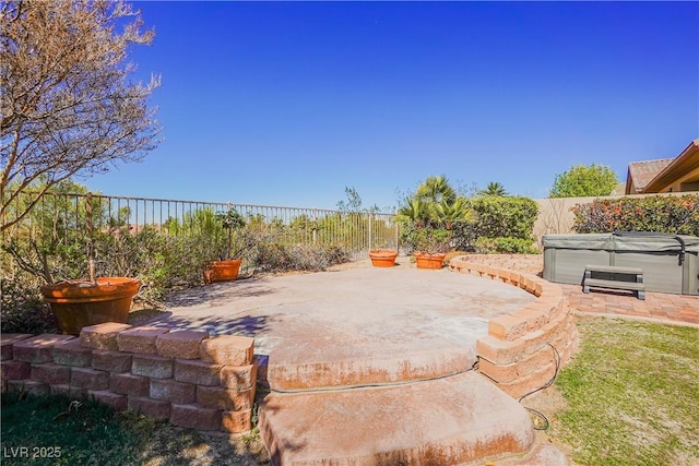 view of patio / terrace with a hot tub