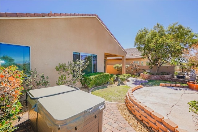 view of patio with a hot tub