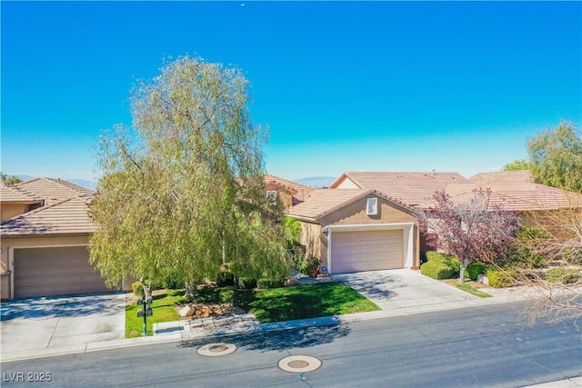 obstructed view of property with a garage