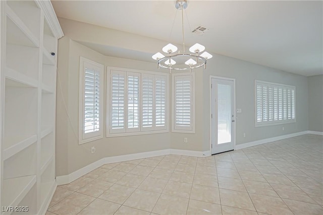 unfurnished dining area with light tile patterned floors and a notable chandelier