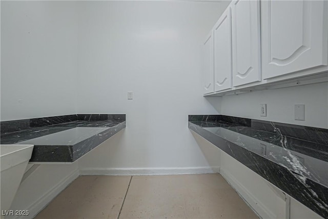 laundry room featuring light tile patterned flooring