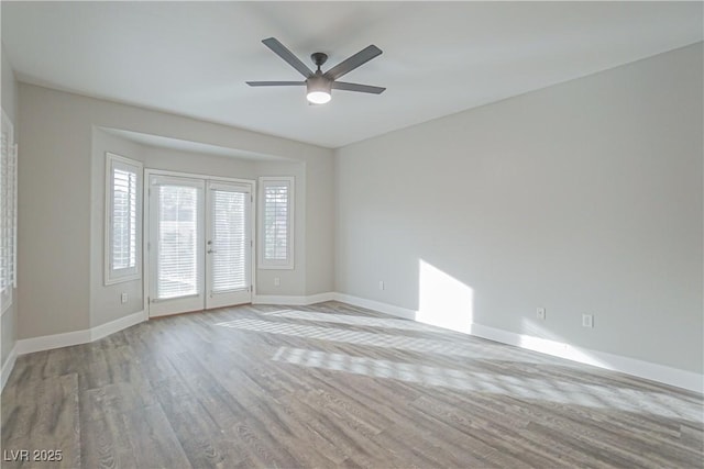 unfurnished room with light hardwood / wood-style flooring, french doors, and ceiling fan