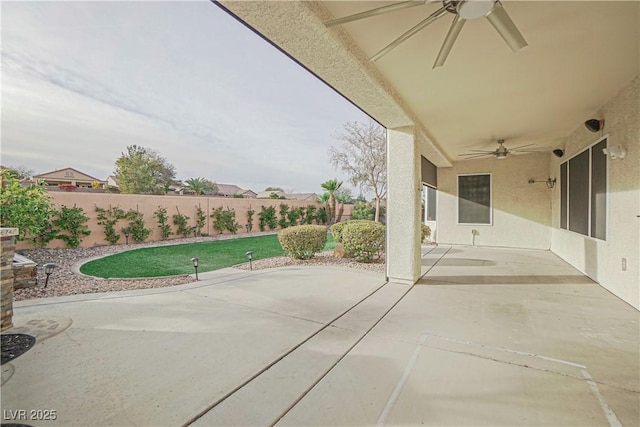 view of patio featuring ceiling fan