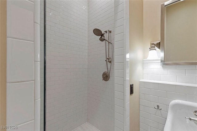 bathroom with tasteful backsplash and tiled shower