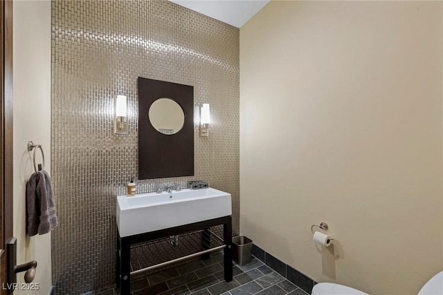 bathroom with tile patterned floors and toilet