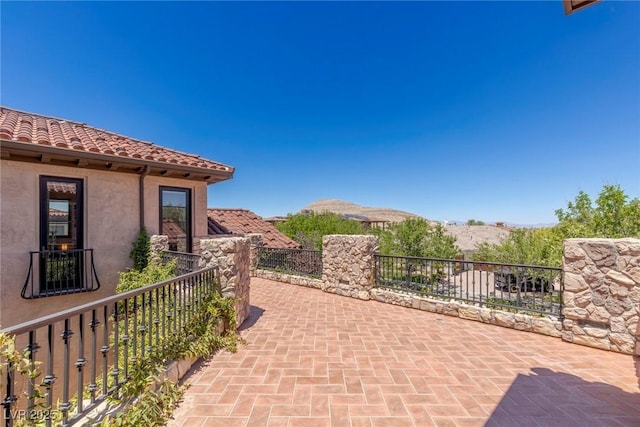 view of patio with a mountain view