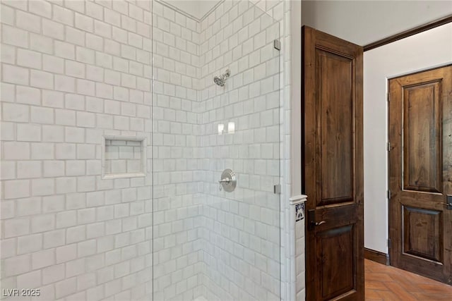 bathroom featuring tiled shower