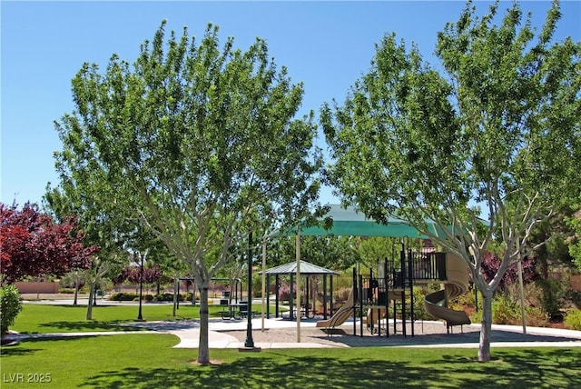 surrounding community featuring a playground and a yard