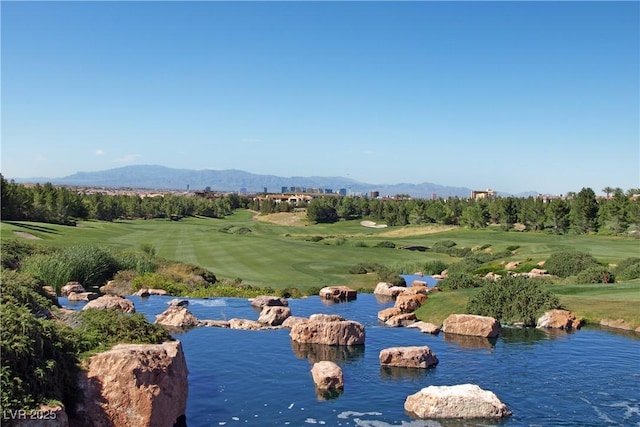 view of property's community featuring a water and mountain view