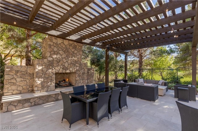 view of patio / terrace with an outdoor living space with a fireplace and a pergola