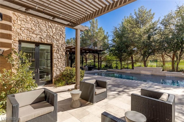 view of patio / terrace featuring a fenced in pool, a pergola, an outdoor hangout area, and french doors