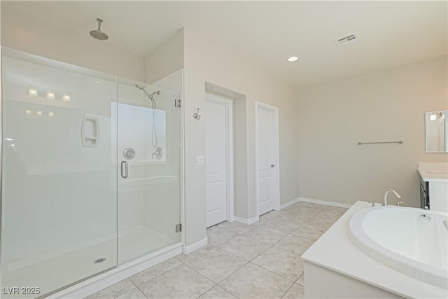 bathroom with vanity, tile patterned floors, and a shower with shower door