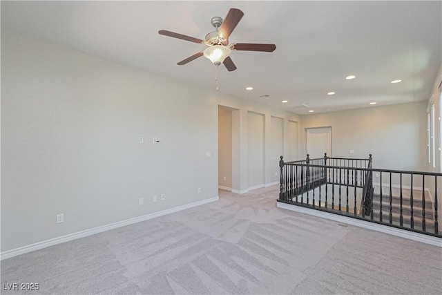 empty room featuring light carpet