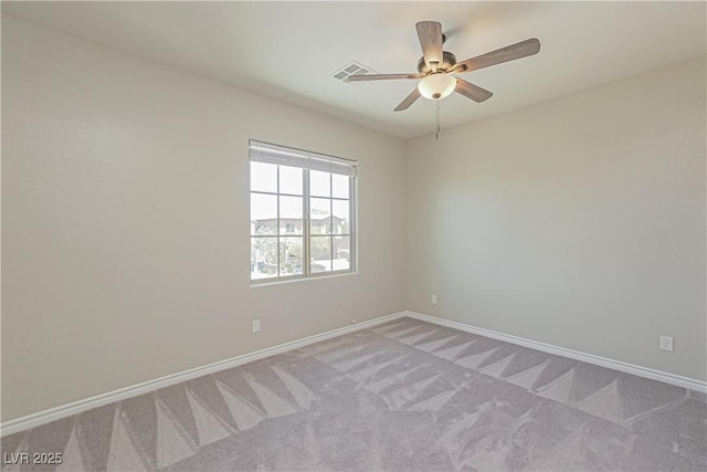 carpeted empty room with ceiling fan