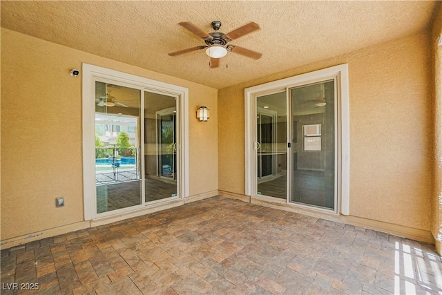 view of patio / terrace featuring ceiling fan