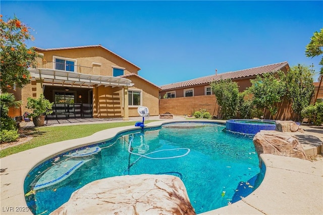 view of pool with an in ground hot tub and a patio