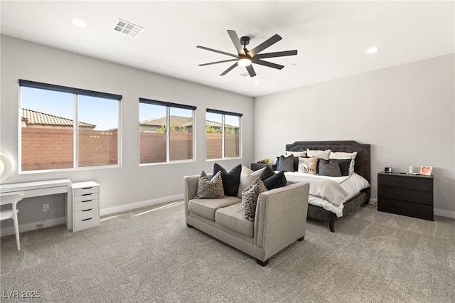 bedroom featuring light colored carpet and ceiling fan