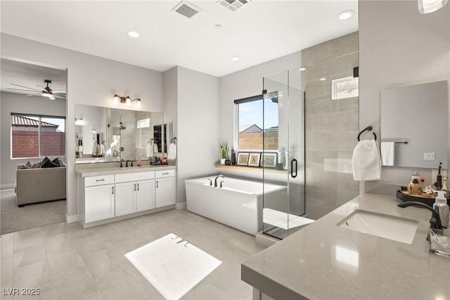 bathroom featuring vanity, shower with separate bathtub, and ceiling fan