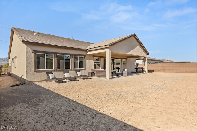 rear view of house featuring a patio