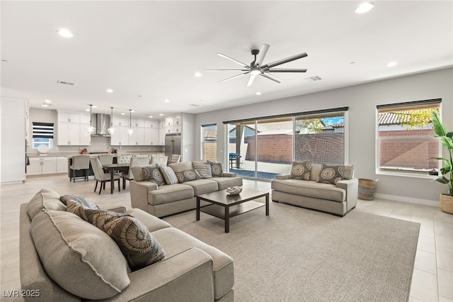 living room featuring a healthy amount of sunlight and light tile patterned floors