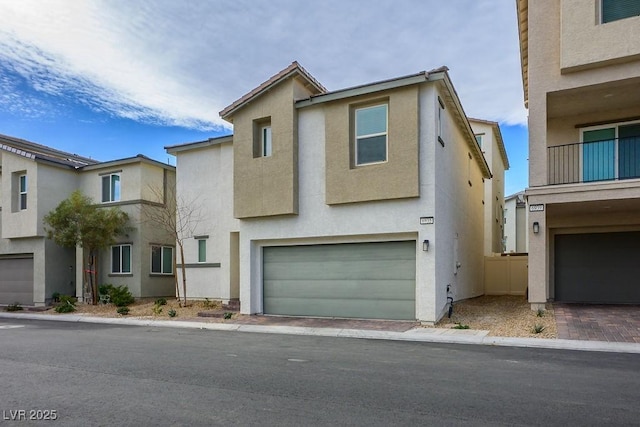 view of front facade featuring stucco siding and an attached garage