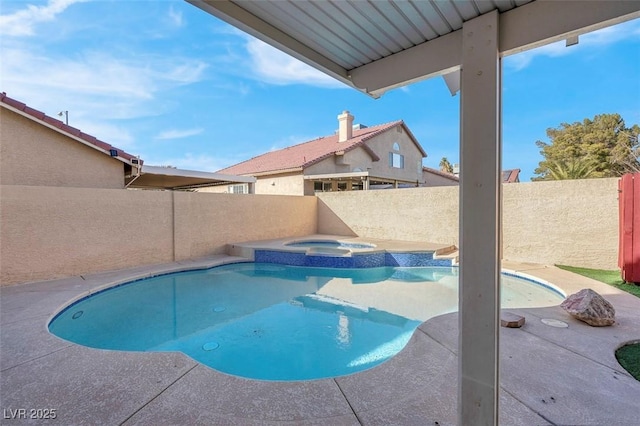 view of swimming pool with an in ground hot tub, a patio area, a fenced backyard, and a fenced in pool