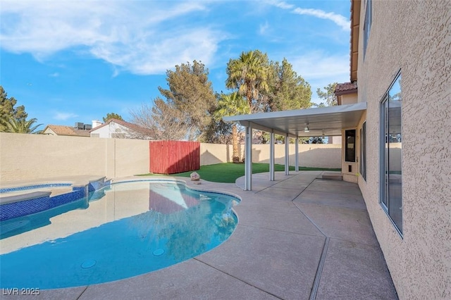 view of swimming pool with a fenced in pool, a fenced backyard, a patio, and an in ground hot tub