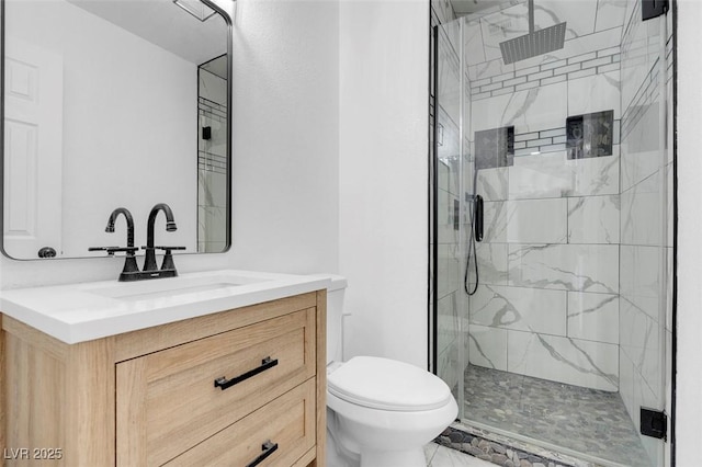 full bath with marble finish floor, vanity, a marble finish shower, and toilet