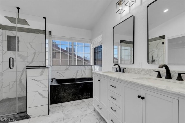 bathroom with a stall shower, marble finish floor, a sink, and double vanity