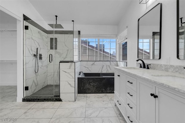 full bath featuring a stall shower, marble finish floor, a sink, and double vanity