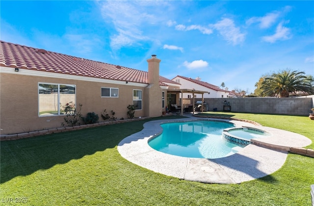 view of pool featuring an in ground hot tub and a lawn